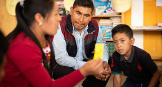 Child Aid Trainer Rosenda Ajpacaja leads a lesson in Thomás Bocel's classroom.