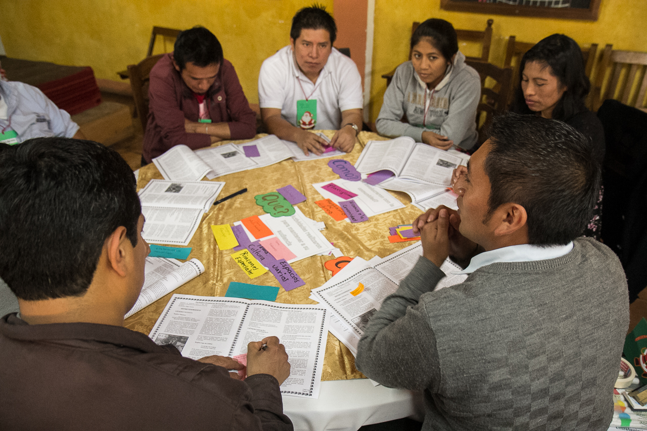 Library Coordinator Carlos Pos leads a small group discussion identifying areas of success in this year's Adventures in Reading program. 